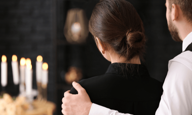 couple at funeral service